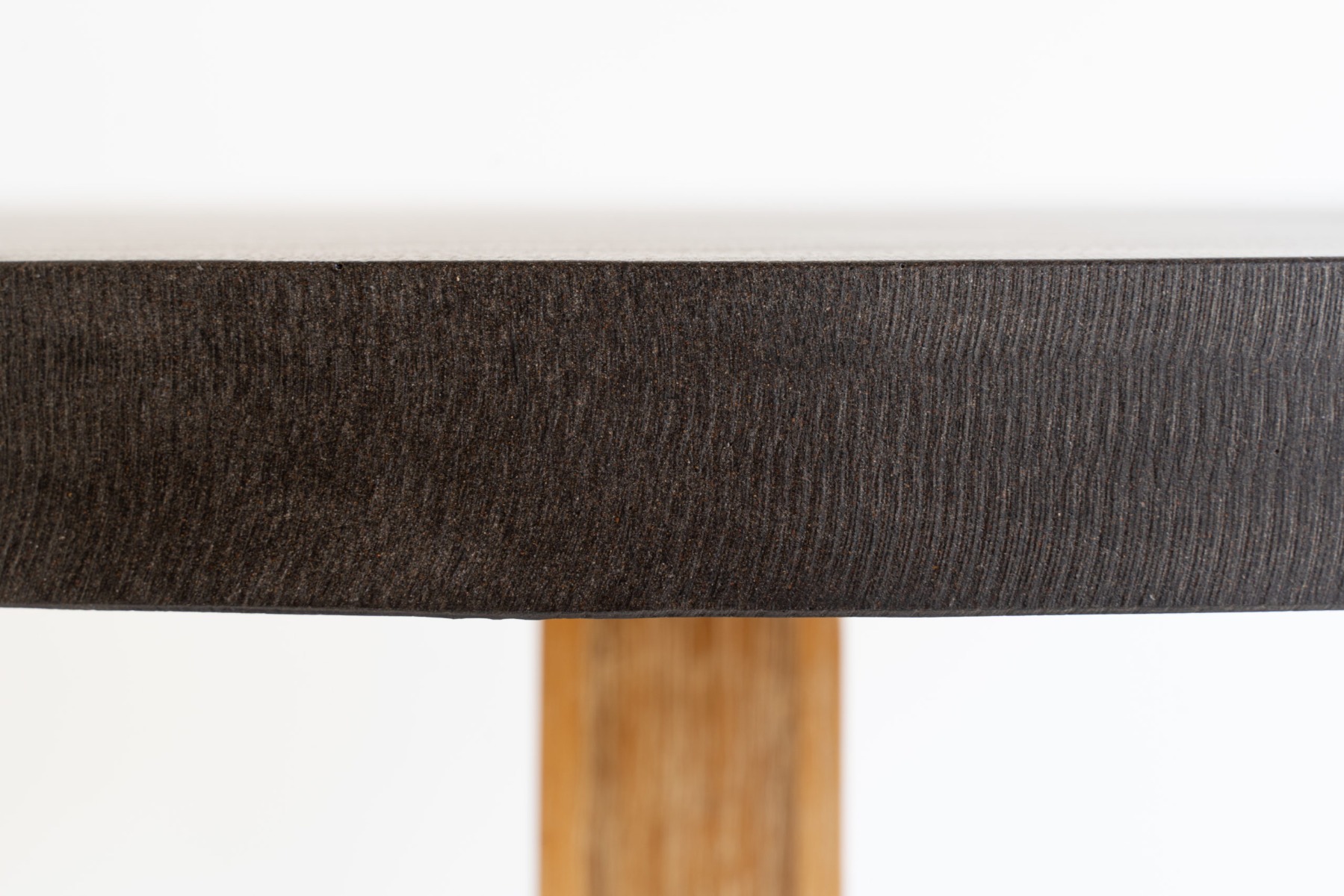 1.0m Alta Round Elkstone Dining Table – Ebony Black with Light Honey Legs - Image 4
